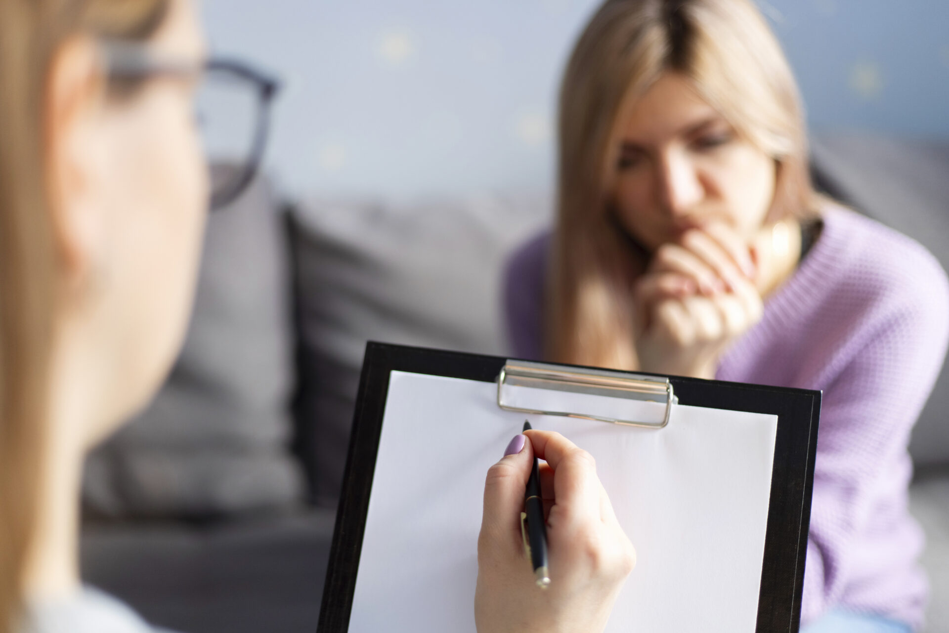 Psychotherapy session, a woman is talking with her psychologist at her office